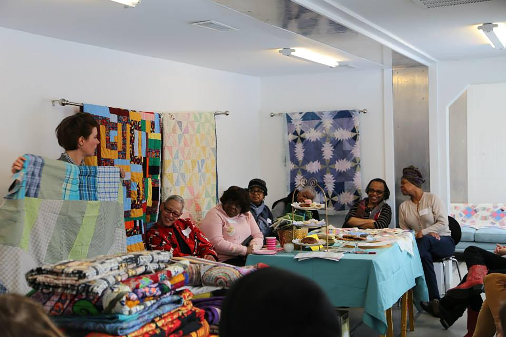 Quilting Bee program inside of the Mobile Homestead, 2014